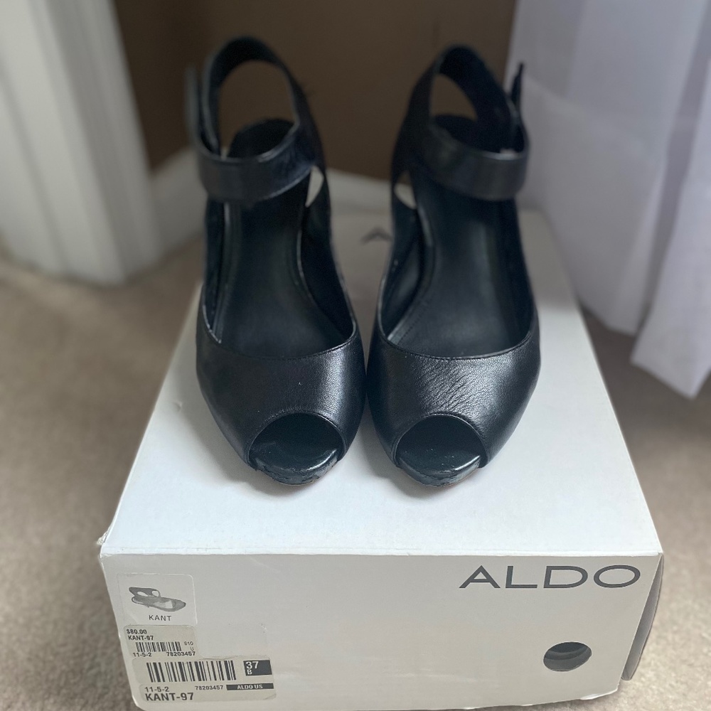 Black dress shoe with wooden heel and ankle strap